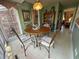 Charming breakfast nook featuring a wood table, decorative lighting, and seating for four with sunlit window views at 106 Jessamine St., Andrews, SC 29510
