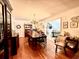 Inviting dining room with wood flooring, chandelier, and seamless transition to a cozy living space at 106 Jessamine St., Andrews, SC 29510