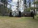 Charming single-story home featuring a well-manicured lawn and a welcoming facade with double doors at 106 Jessamine St., Andrews, SC 29510
