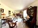Spacious living room featuring an abundance of natural light, neutral walls, and a variety of seating options at 106 Jessamine St., Andrews, SC 29510