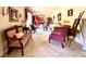 Inviting living room with neutral carpet, art-adorned walls, and elegant seating, perfect for relaxation and entertaining at 106 Jessamine St., Andrews, SC 29510