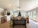 Light-filled sun room with a Christmas tree, tile floors, and ample natural light at 106 Jessamine St., Andrews, SC 29510