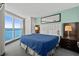 Comfortable bedroom features a large window with ocean views and closet at 107 S Ocean Blvd. # 1201, Myrtle Beach, SC 29577