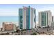 An oceanside condo features blue and gray modern construction and ocean views in this attractive listing photo at 107 S Ocean Blvd. # 1201, Myrtle Beach, SC 29577