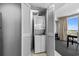 Convenient laundry closet featuring a stacked washer and dryer unit at 107 S Ocean Blvd. # 1201, Myrtle Beach, SC 29577