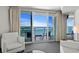 Inviting living area features balcony access and comfortable seating at 107 S Ocean Blvd. # 1201, Myrtle Beach, SC 29577