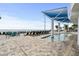 Relax poolside with plenty of lounge seating, tables, and a sun shade at this vacation condo at 107 S Ocean Blvd. # 1201, Myrtle Beach, SC 29577