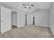 Spacious bedroom with vaulted ceiling, carpeted floor, and view to walk-in closet and bathroom at 1098 Stanton Pl., Myrtle Beach, SC 29579