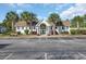 Charming community clubhouse with palm trees and ample parking for resident's convenience at 1098 Stanton Pl., Myrtle Beach, SC 29579