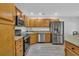 Well-lit kitchen features stainless steel appliances, light wood cabinets, and granite countertops at 1098 Stanton Pl., Myrtle Beach, SC 29579