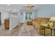 Bright and cozy living room featuring a plush sofa, wood floors, and large window at 1098 Stanton Pl., Myrtle Beach, SC 29579