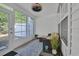 Sunroom with white walls, wicker furniture, ceiling fan, and views of the backyard at 1098 Stanton Pl., Myrtle Beach, SC 29579