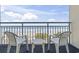 Balcony with chairs and table, overlooking the beach and ocean at 1105 S Ocean Blvd. # 422, Myrtle Beach, SC 29577