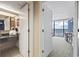Bathroom view with a sink and a partial view of the living room and balcony at 1105 S Ocean Blvd. # 422, Myrtle Beach, SC 29577