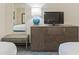 Well-appointed bedroom includes a TV and a bench for additional comfort at 1105 S Ocean Blvd. # 422, Myrtle Beach, SC 29577