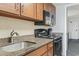 Well-equipped kitchen features wooden cabinets, countertop, and modern appliances at 1105 S Ocean Blvd. # 422, Myrtle Beach, SC 29577