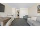 Open living space including a sofa, dining area and connecting hallway at 1105 S Ocean Blvd. # 422, Myrtle Beach, SC 29577