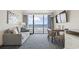 Inviting living room with sofa, dining table, and ocean view balcony at 1105 S Ocean Blvd. # 422, Myrtle Beach, SC 29577
