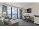 Living room with sofa, dining area and ocean view balcony with natural light at 1105 S Ocean Blvd. # 422, Myrtle Beach, SC 29577