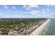 Breathtaking aerial view of the coastal neighborhood, beach, and surrounding greenery at 1114 S Dogwood Dr., Surfside Beach, SC 29575