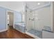 This spacious bathroom has a soaking tub and a glass-enclosed shower, all with tasteful blue accents at 1114 S Dogwood Dr., Surfside Beach, SC 29575