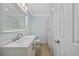 Bathroom with a single vanity, a patterned shower curtain and modern fixtures at 1114 S Dogwood Dr., Surfside Beach, SC 29575