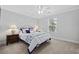 This charming bedroom features a nautical themed bed, a ceiling fan, and natural light from a window at 1114 S Dogwood Dr., Surfside Beach, SC 29575