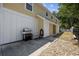 Exterior with gas grill, storage, and gravel area at 1114 S Dogwood Dr., Surfside Beach, SC 29575