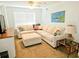 Comfortable living room featuring a large sectional sofa and a corner window at 1114 S Dogwood Dr., Surfside Beach, SC 29575