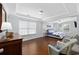 Relaxing main bedroom with tray ceilings, hardwood floors, plenty of natural light, and coastal decor at 1114 S Dogwood Dr., Surfside Beach, SC 29575