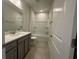 Bathroom featuring single vanity and a shower-tub combination at 1233 Lady Bird Way, North Myrtle Beach, SC 29582