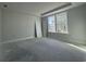 Bedroom with a trey ceiling, base trim, and two double-hung windows providing natural light at 1233 Lady Bird Way, North Myrtle Beach, SC 29582