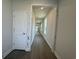 Long hallway featuring recessed lighting, neutral walls, and modern wood-look flooring at 1233 Lady Bird Way, North Myrtle Beach, SC 29582