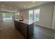 Kitchen with a black island, stainless steel appliances, and open-concept layout at 1233 Lady Bird Way, North Myrtle Beach, SC 29582