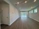 Bright living room with sliding doors, recessed lighting, and modern vinyl flooring at 1233 Lady Bird Way, North Myrtle Beach, SC 29582