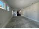 Unfinished living room featuring large windows providing natural light and an open floor plan at 1233 Lady Bird Way, North Myrtle Beach, SC 29582