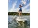 Personal enjoys paddleboarding in the lake at 1233 Lady Bird Way, North Myrtle Beach, SC 29582