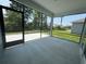 Spacious screened porch with a concrete floor, offering a seamless transition to the outdoors at 1233 Lady Bird Way, North Myrtle Beach, SC 29582