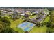 Aerial view showcasing community pickleball courts, playground, pool, parking, and lush landscaping at 1315 Ashboro Ct., Myrtle Beach, SC 29579
