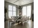 Elegant dining room with contemporary lighting, stylish decor, and ample seating at 1315 Ashboro Ct., Myrtle Beach, SC 29579