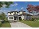 Stunning two-story home featuring a modern design, stone accents, and a well-manicured lawn at 1315 Ashboro Ct., Myrtle Beach, SC 29579