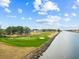 Picturesque golf course with a water feature, providing a scenic and challenging experience for golfers at 1315 Ashboro Ct., Myrtle Beach, SC 29579