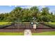 Community playground with swings, slides, and climbing structures, surrounded by a secure fence at 1315 Ashboro Ct., Myrtle Beach, SC 29579