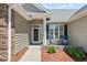 Inviting front porch with seating and a well-maintained entrance, creating a welcoming atmosphere at 136 Regency Dr., Conway, SC 29526