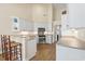 Well-lit kitchen featuring a breakfast bar, modern appliances, and neutral countertops and cabinets at 136 Regency Dr., Conway, SC 29526