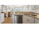 Well-equipped kitchen features stainless steel appliances, light countertops, and a view into the dining area at 136 Regency Dr., Conway, SC 29526