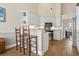Open kitchen with white cabinets, stainless steel appliances, and a breakfast bar for casual dining at 136 Regency Dr., Conway, SC 29526