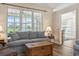 Bright living room with a view to screened porch offers comfortable seating and natural light at 136 Regency Dr., Conway, SC 29526