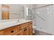 Bright bathroom featuring a white vanity, sink, cabinet, and walk-in shower with safety grab bars at 138 Lumbee Circle # 17, Pawleys Island, SC 29585