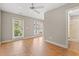 Bright bedroom with hardwood floors, and a door leading to the outside at 138 Lumbee Circle # 17, Pawleys Island, SC 29585